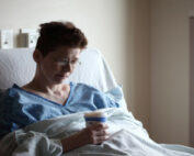 Woman in hospital bed.
