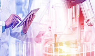 image of a doctor using a tablet and microsope