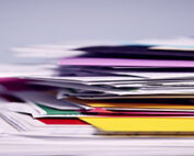 a stack of papers and folders