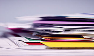 a stack of papers and folders