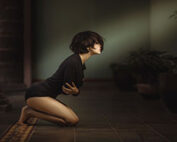 woman on knees in pain