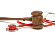 Gavel and Stethoscope on white background