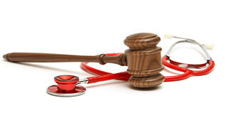Gavel and Stethoscope on white background