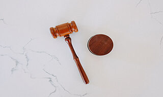 judge's gavel on marble backdrop