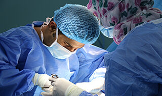 vaginal mesh surgeon operating on a patient