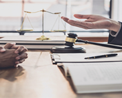 attorney at a desk with a client - tvm