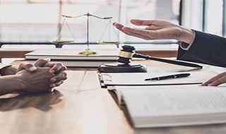 attorney at a desk with a client - tvm