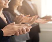a group of people clapping their hands