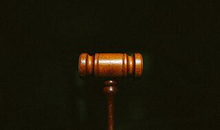 Gavel on dark background.