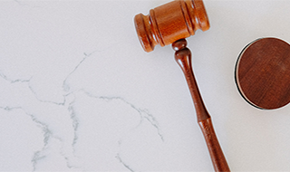 a gavel on a marble table